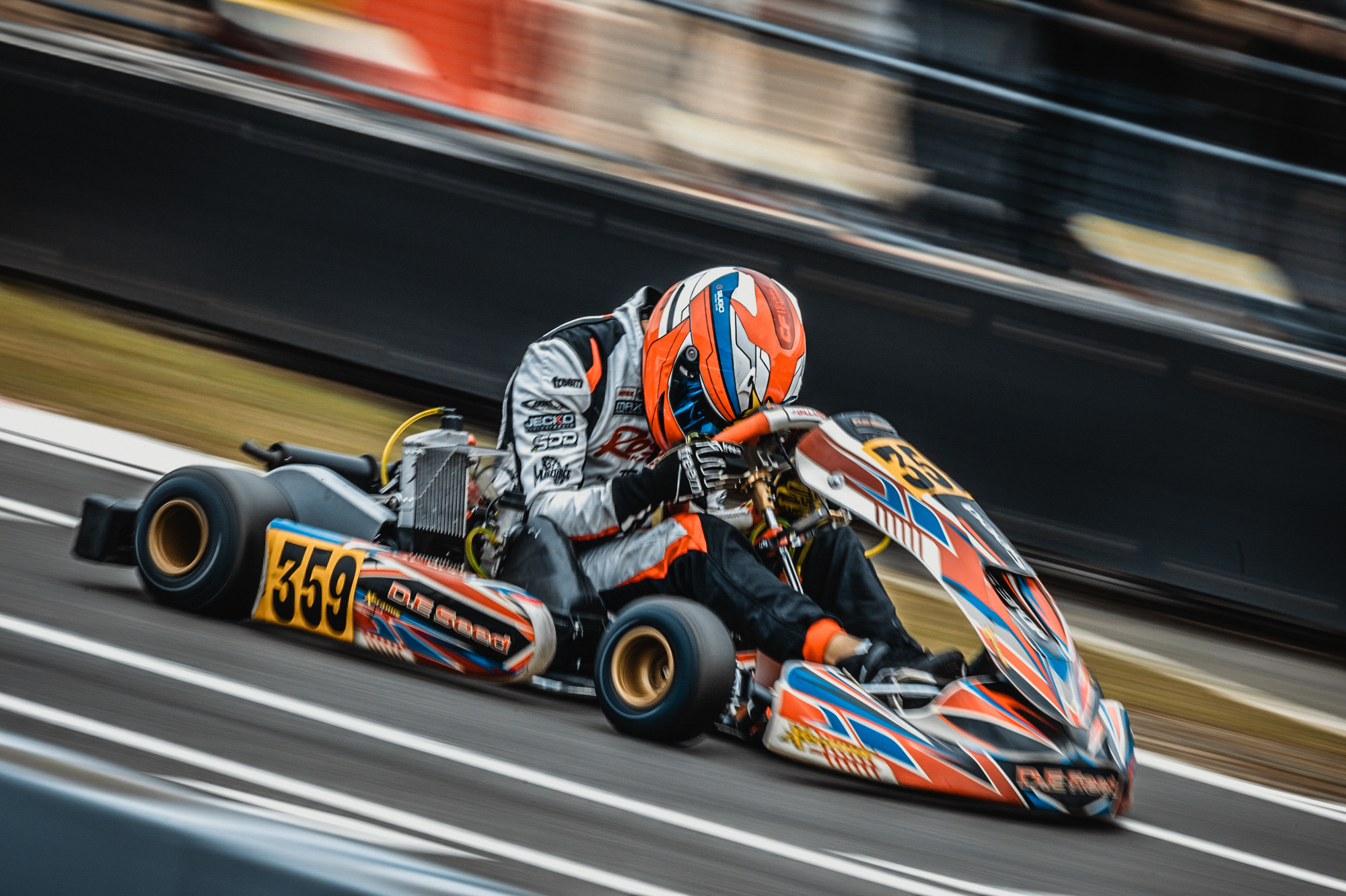 Kart #359 attacking a corner, background streaked with motion